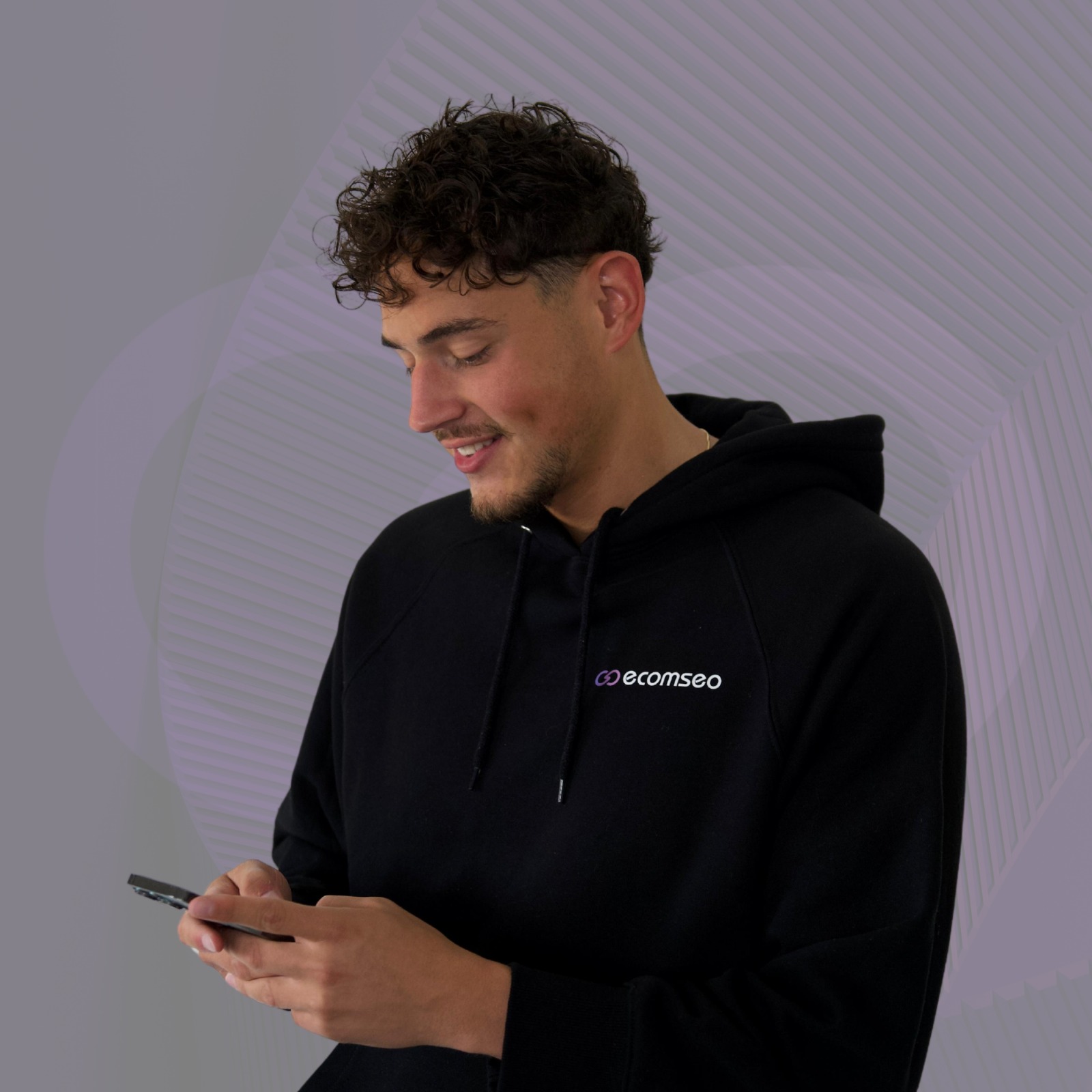 Charlie Fayez with EcomSEO hoodie on telephone